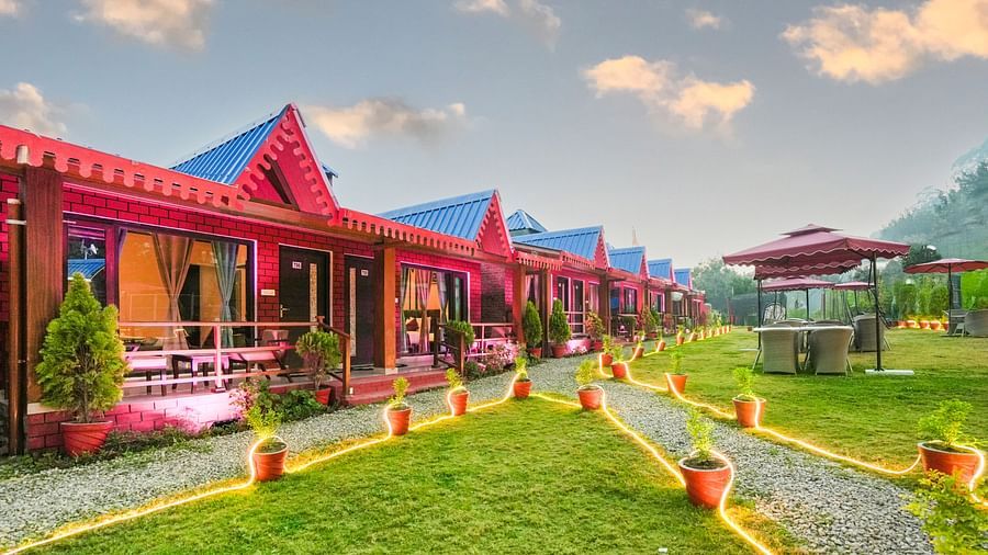 Sol Glow Resort, Nainital Nainital Cottages placed adjacently, with pots paving way on the walking path, decorated with LED lights